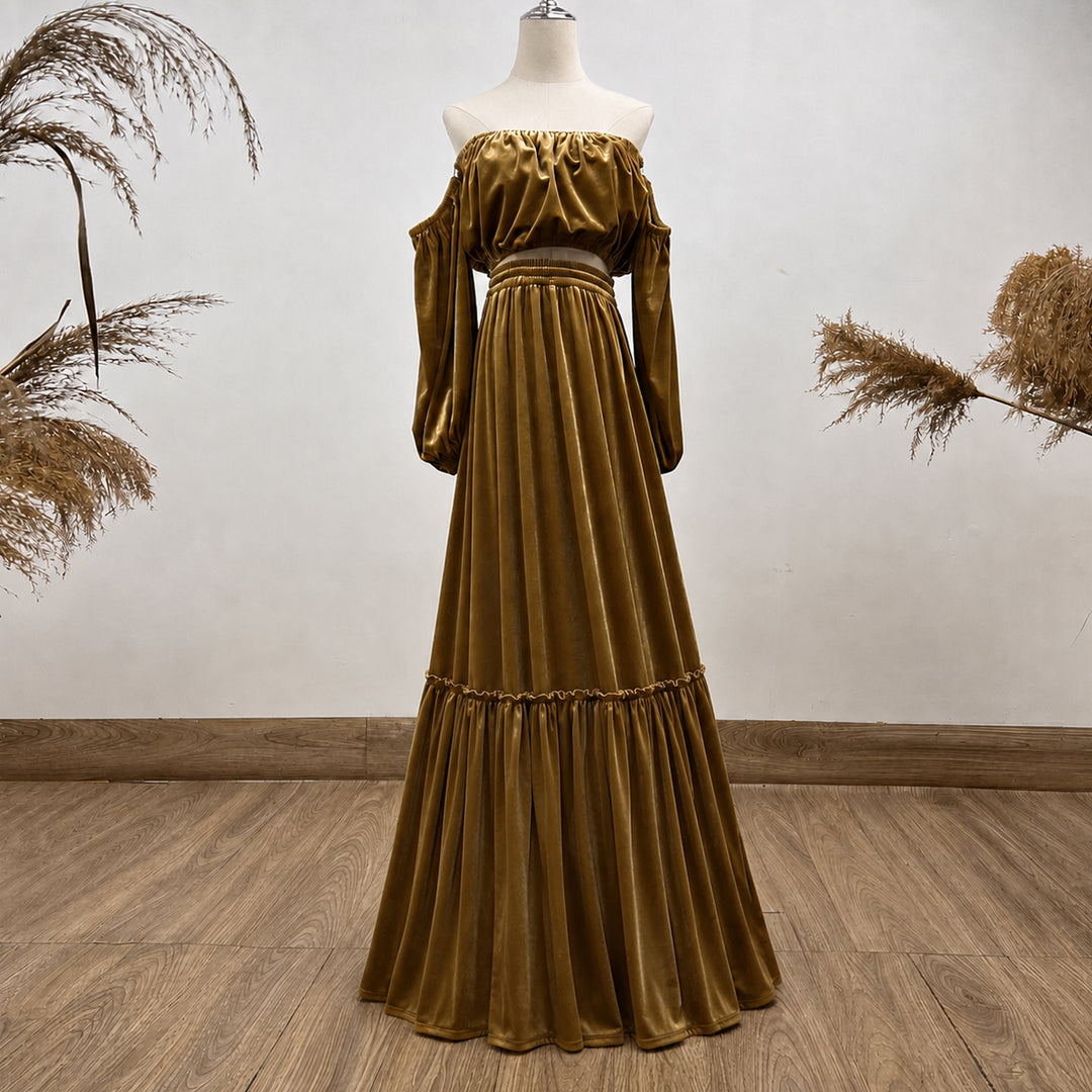A KO-9,a Belisama velvet off-shoulder top and floor-length skirt are displayed on a mannequin. The two-piece outfit has a ruffled skirt hem.