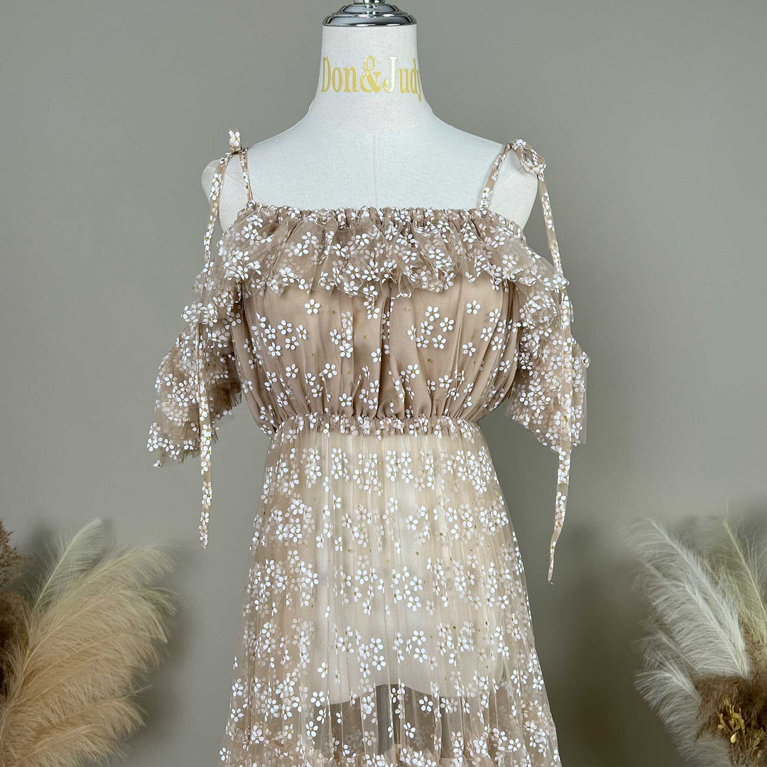 A Ersa khaki tulle dress with white floral embroidery and tie-shoulder straps, displayed on a mannequin.